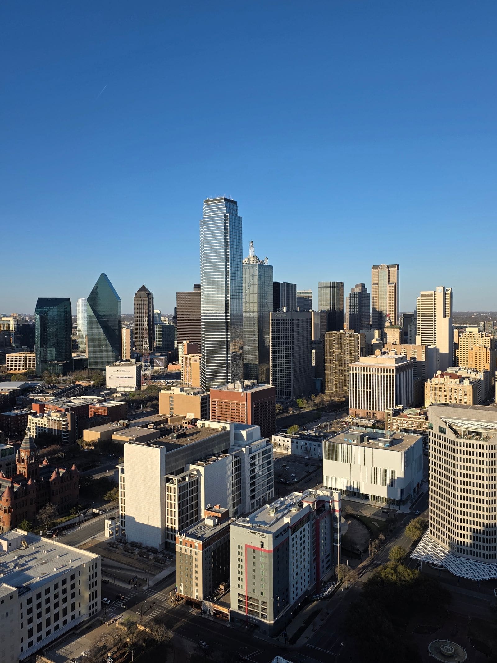 Downtown Dallas skyline under a blue sky